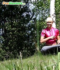 Adorable blond chick filmed tinkling in the park