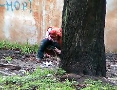 Hot girl with red hair filmed on the sly having a pee