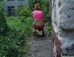 Redhead pussycat pulls her panties off to urinate