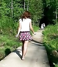 Shameless young girl caught peeing on park path